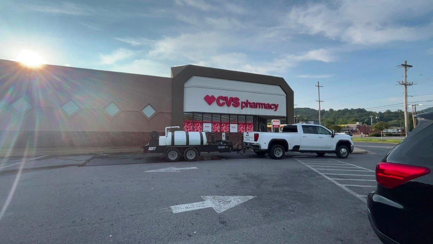 Chem-Clean rig and pickup truck parked in a pharmacy parking lot