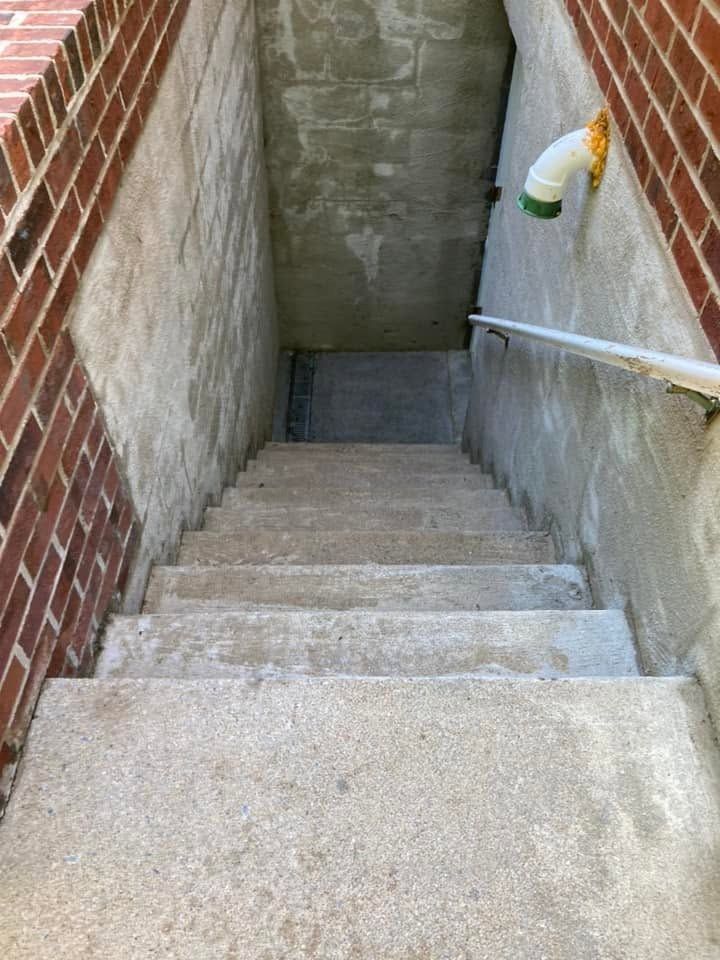 The same stairwell steps and walls lighter and clean after washing