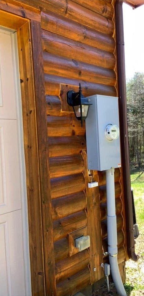 The same log wall washed to a warm, clean finish