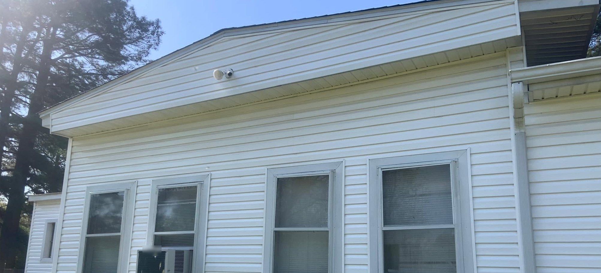 The same wall and eave bright white after soft washing