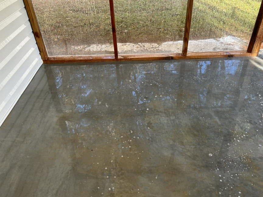 Screened porch concrete floor wet and foamy while it is being washed
