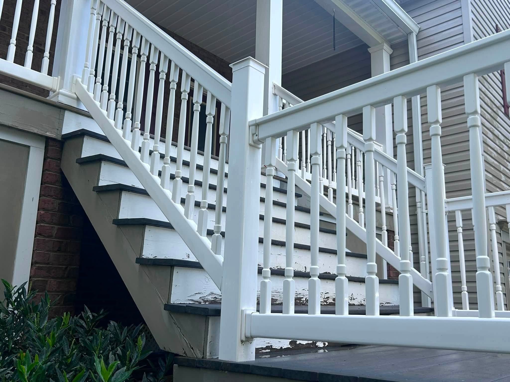 The same railing after washing, clean white rails and balusters