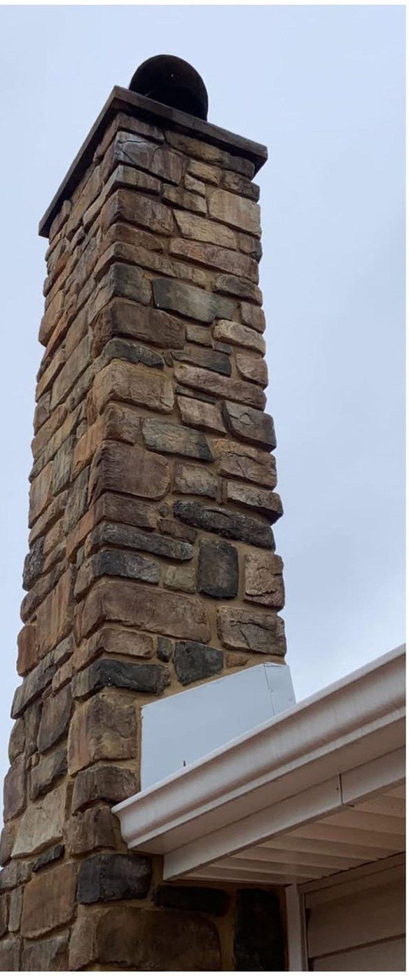 The same stone chimney after rust stain removal